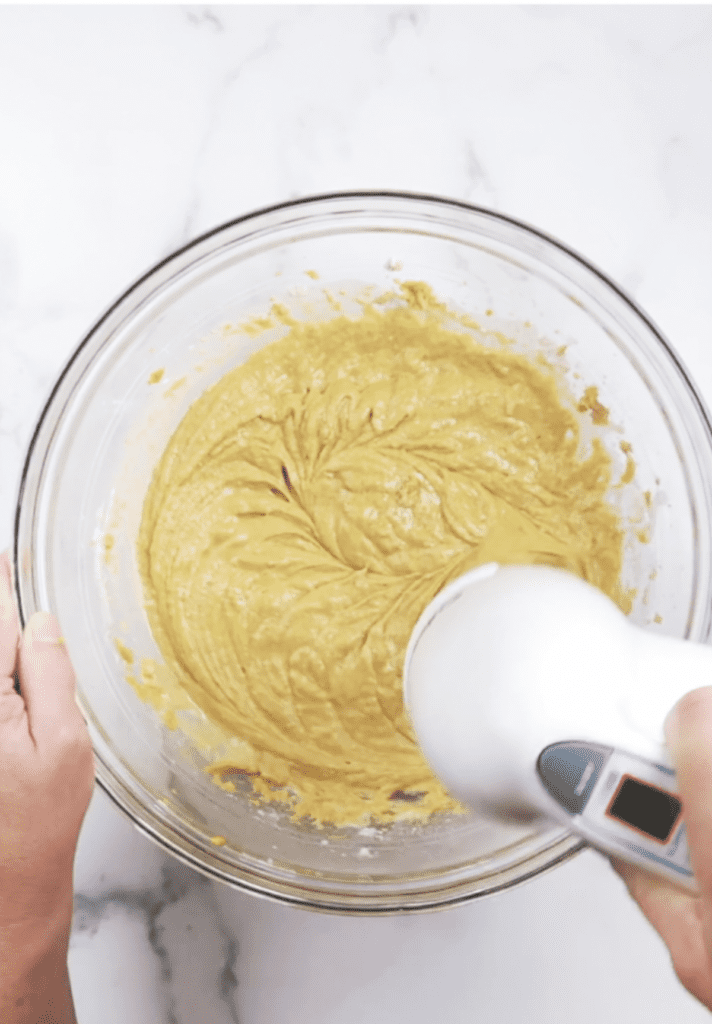 pumpkin cake being mixed