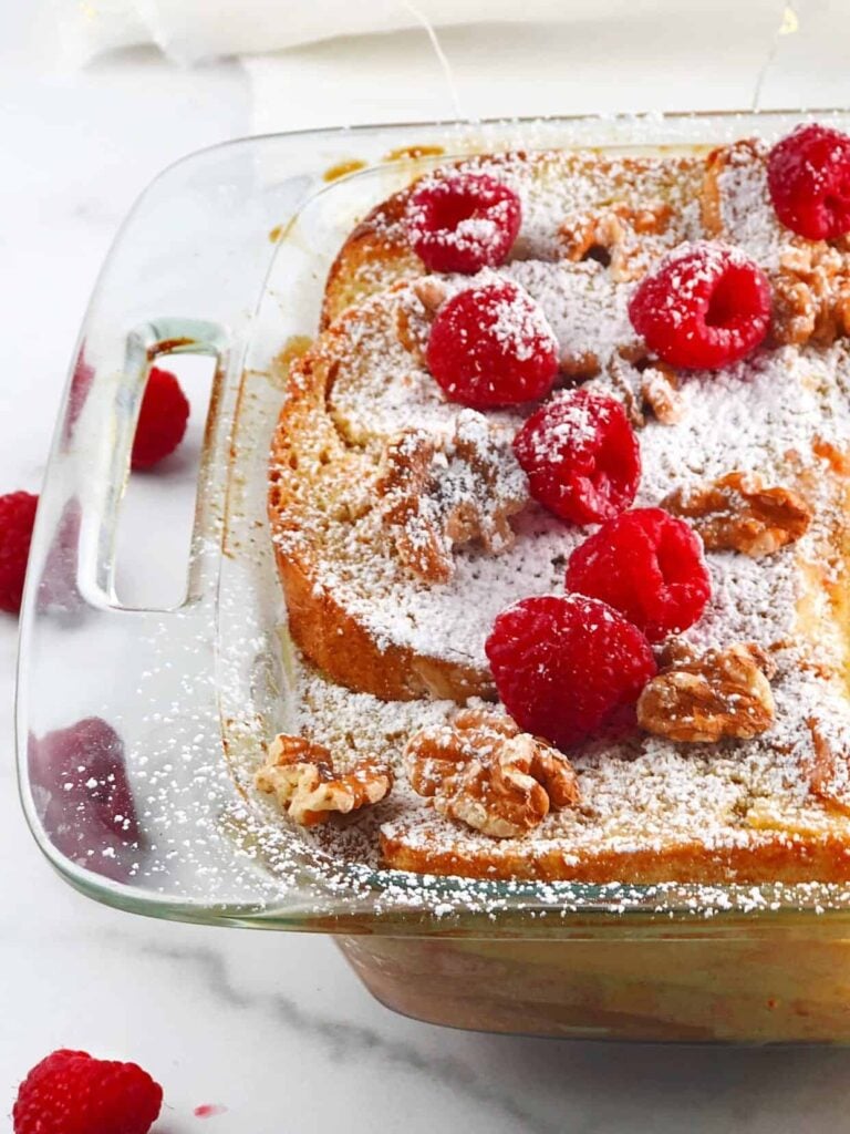 oven baked French toast with berries on top in pan