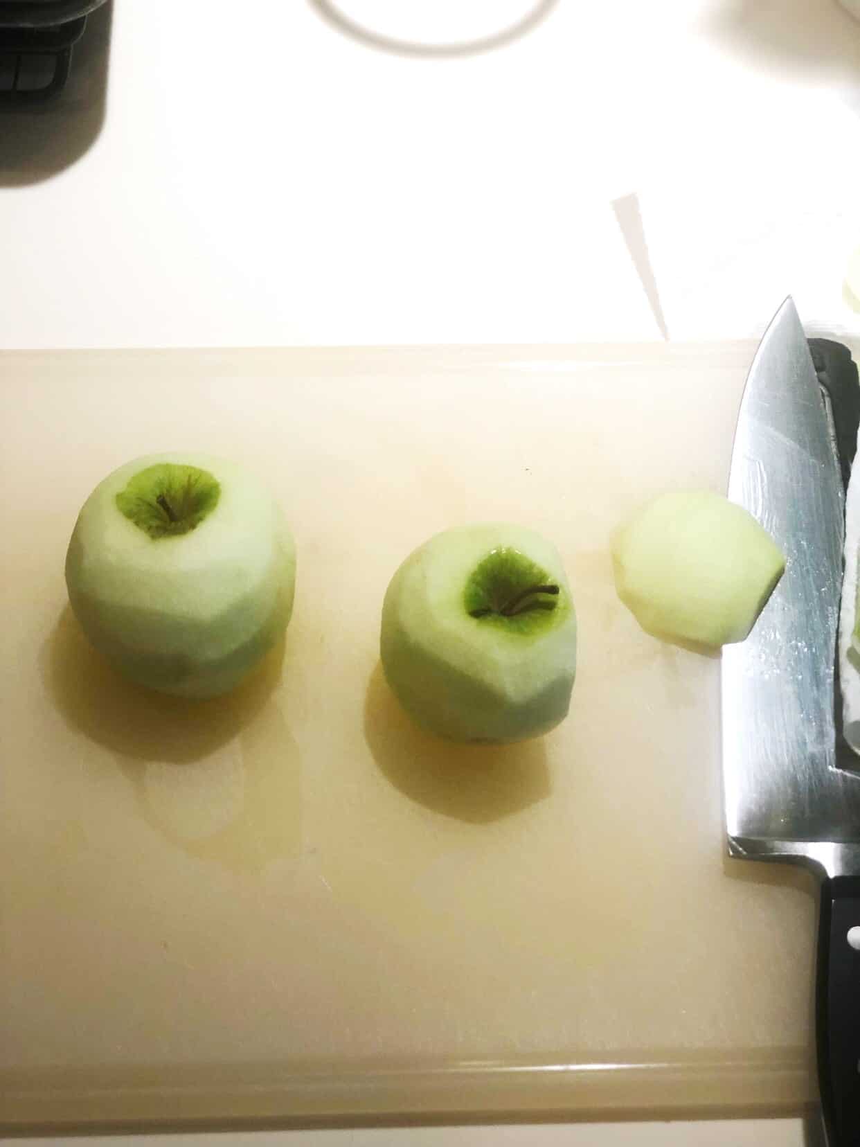 peeled and cut apples on a cutting board