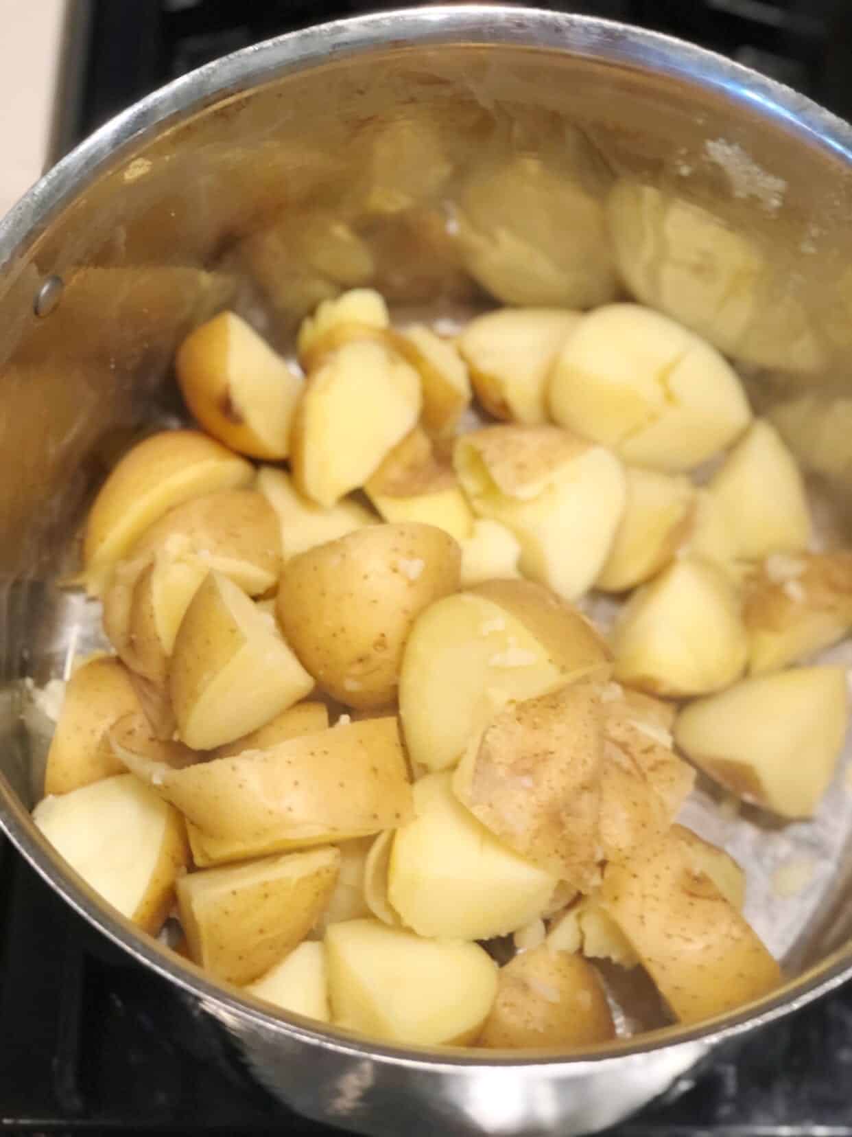 Cubed potatoes in pot