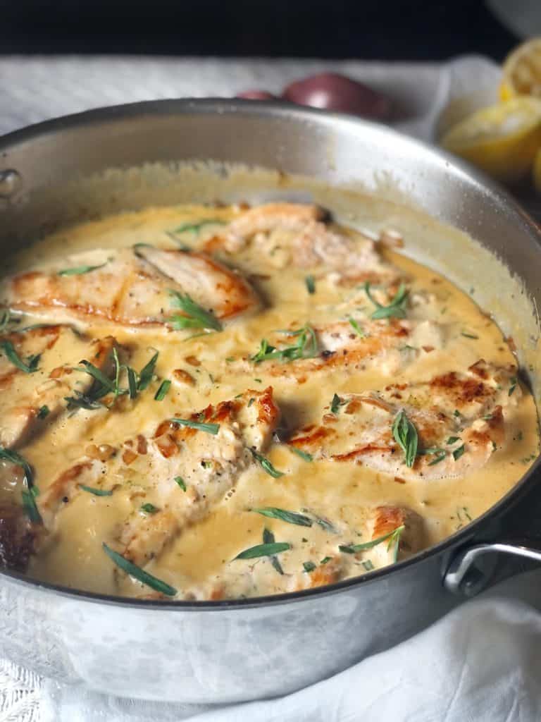 a closeup view of chicken tarragon in a saute pan