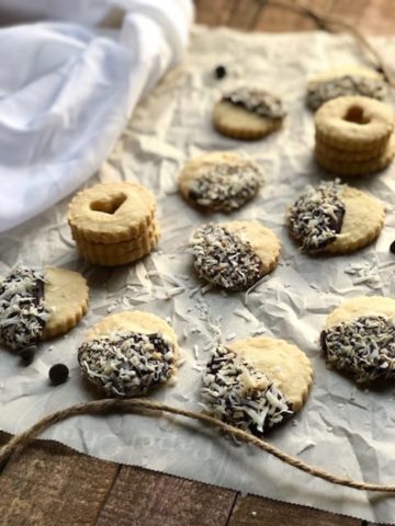 cardamom-shortbread-cookies-with-chocolate-and-coconut on table