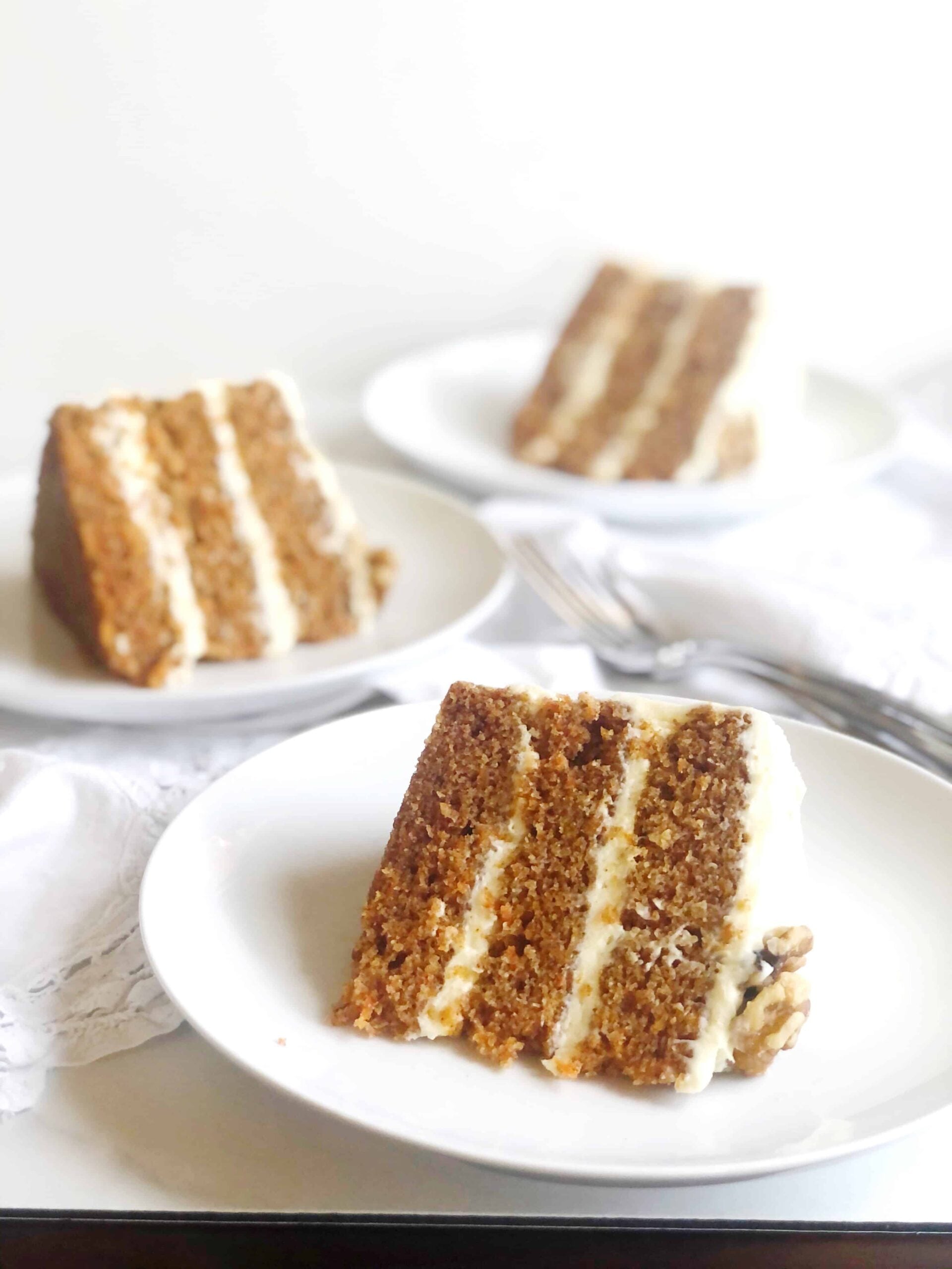 slices of carrot cake in a row