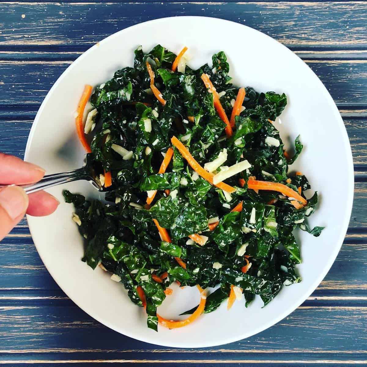 kale and carrot salad in bowl