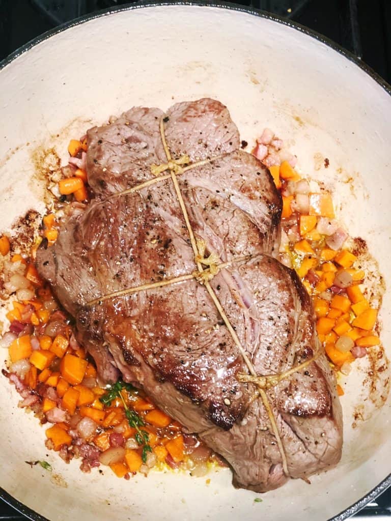 adding meat to genovese sauce