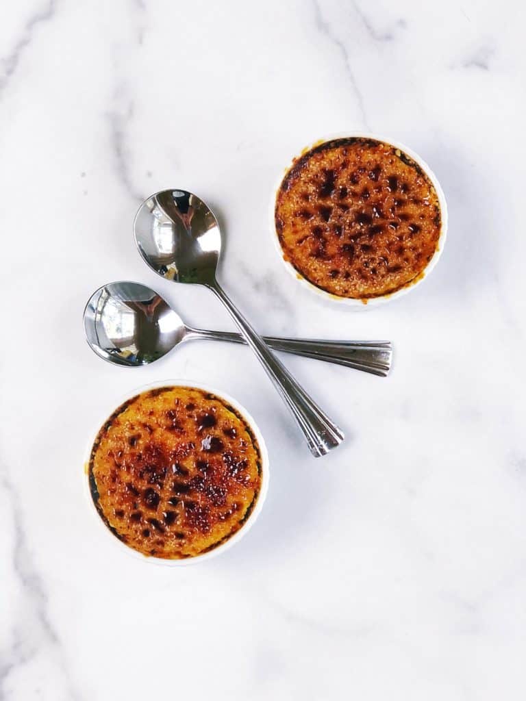 pumpkin creme brulee with a sugar crust on table