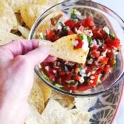 scooping up homemade pico de gallo