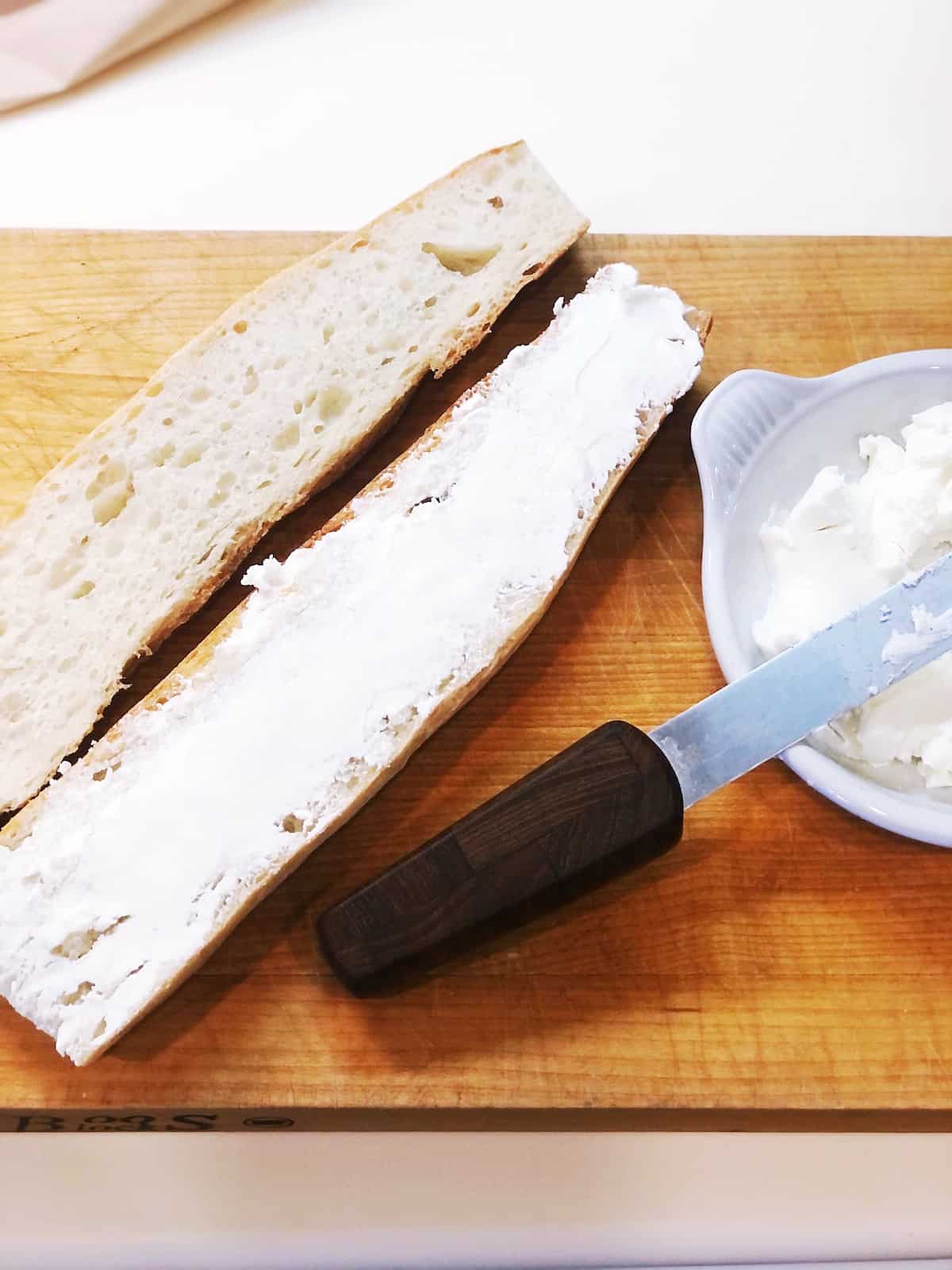 goat cheese spread on baguette