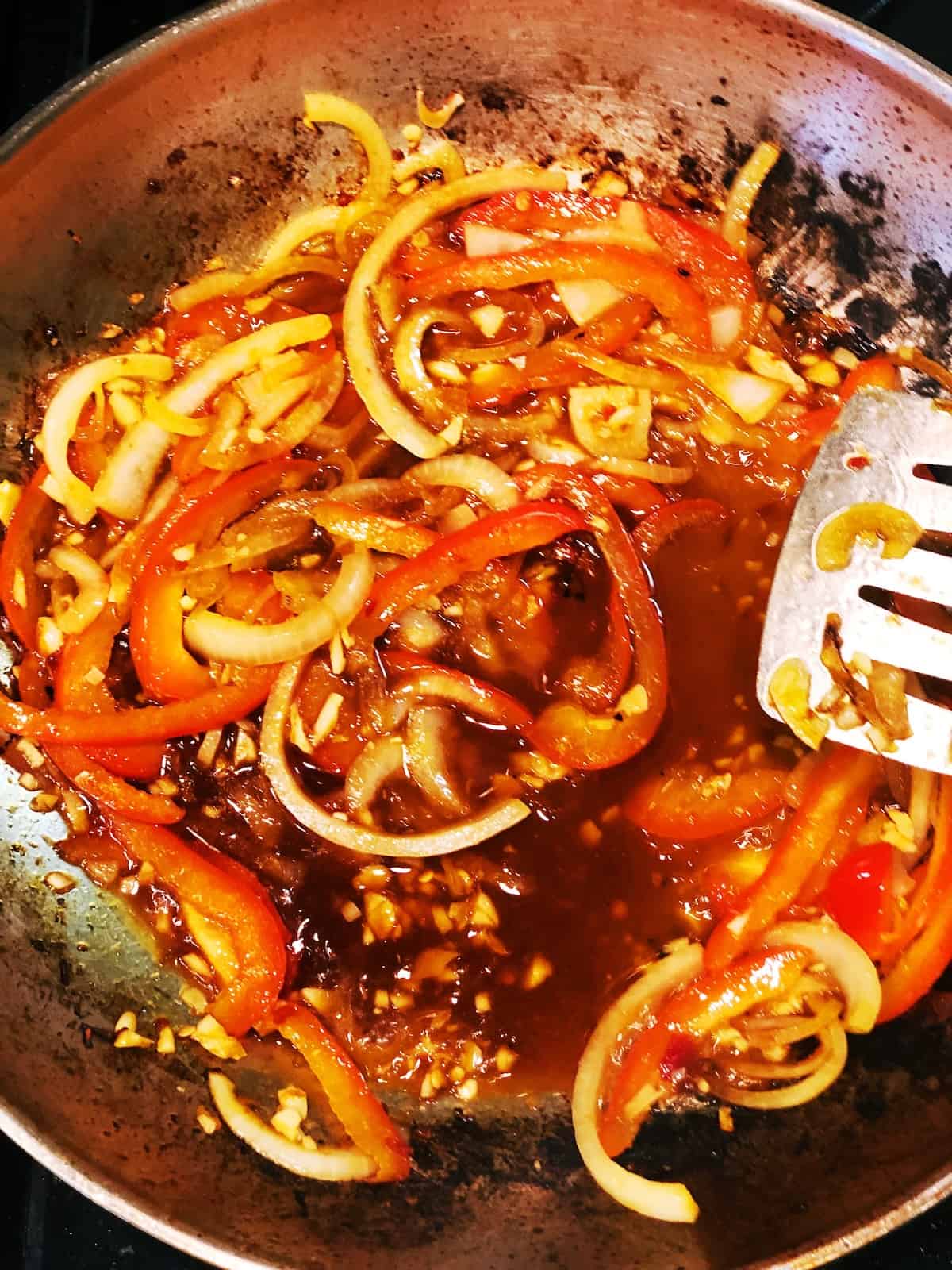 adding liquids to stir fry