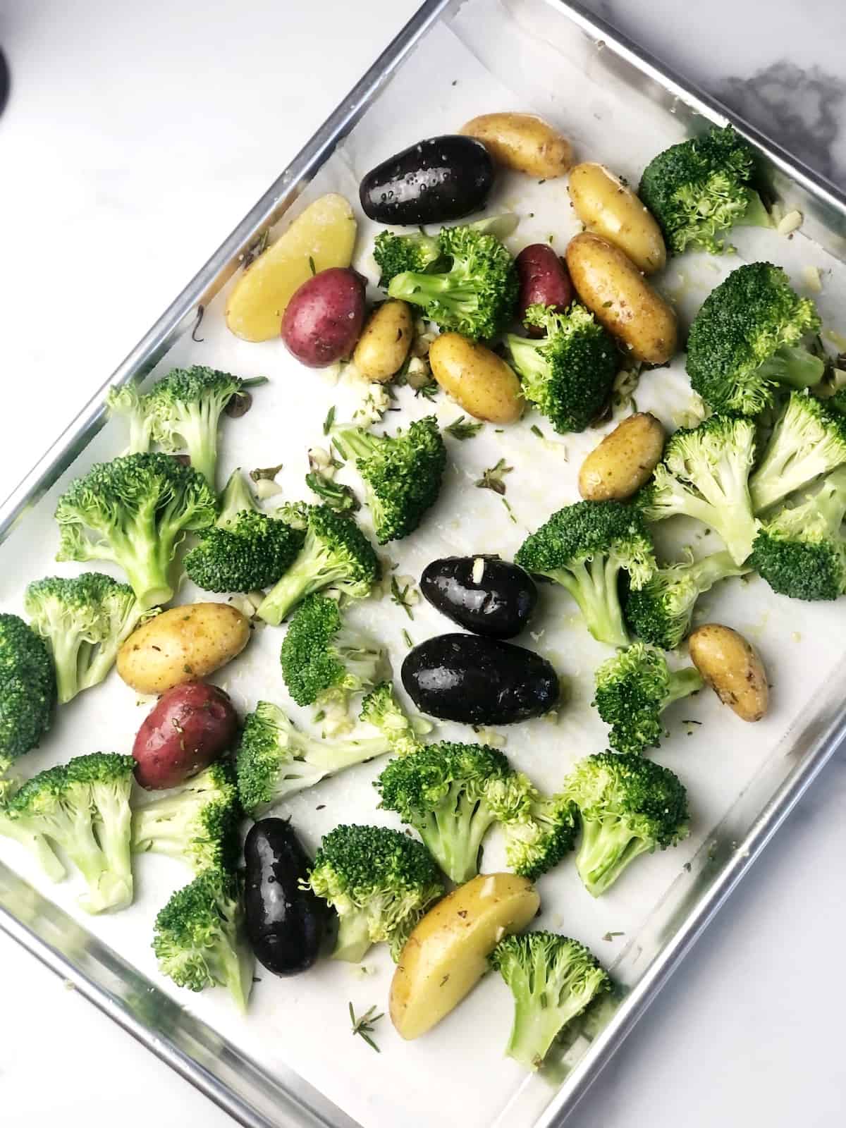 potatoes and broccoli on sheet pan