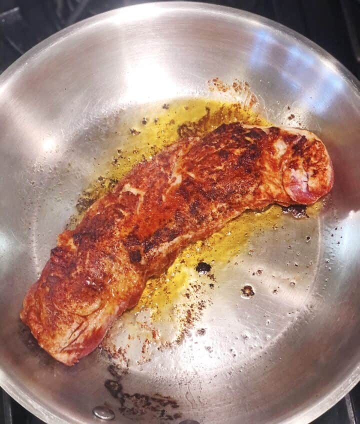 searing pork tenderloin on both sides