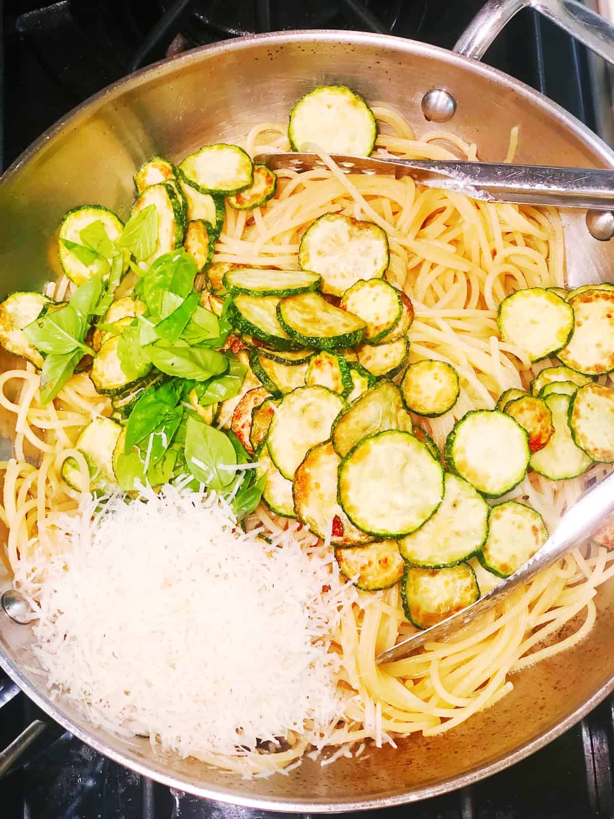 tossing pasta nerano in pan