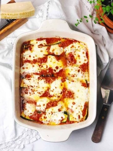 Italian baked zucchini in pan on a table.