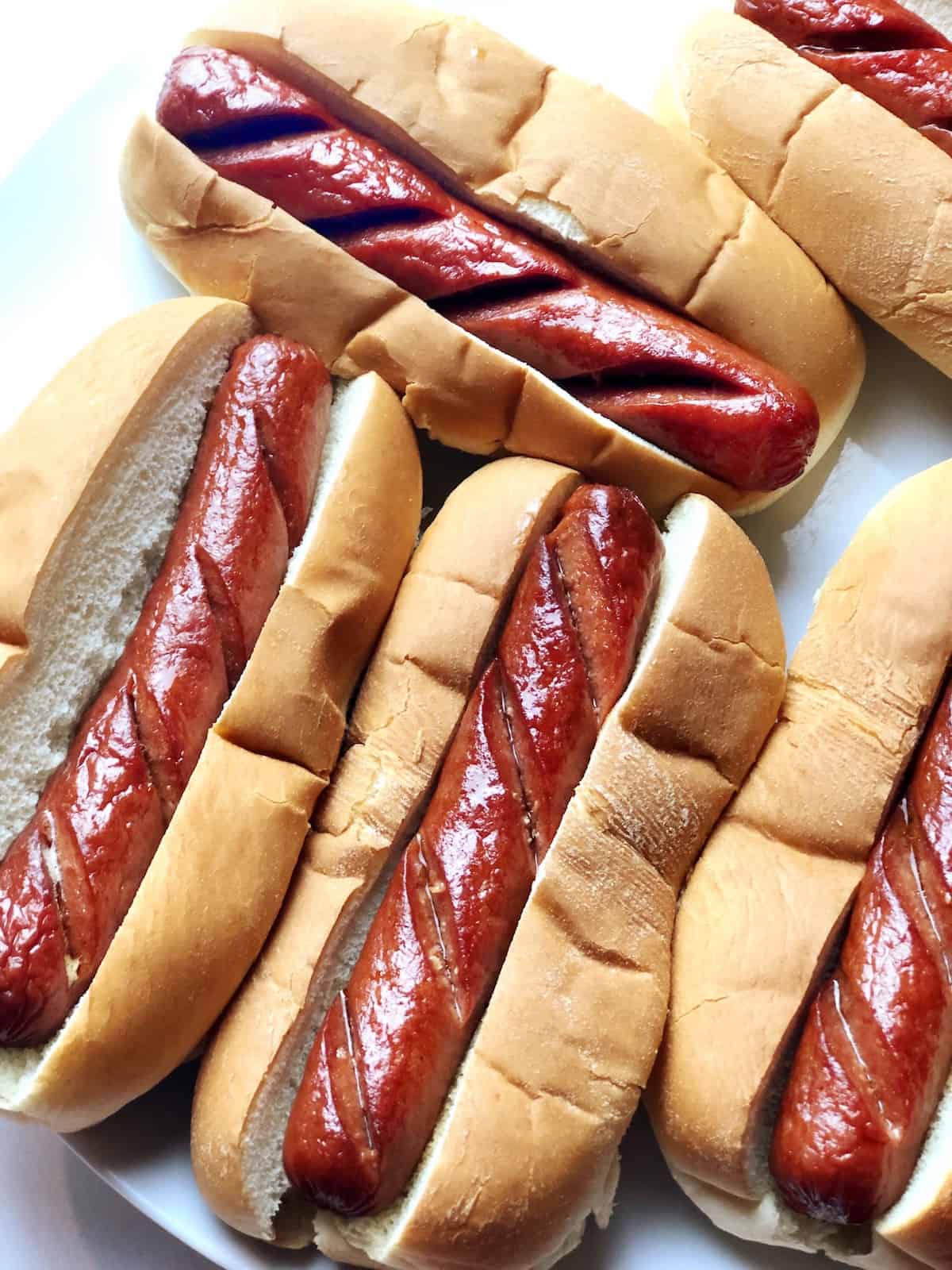 closeup of air fryer hot dogs in bun