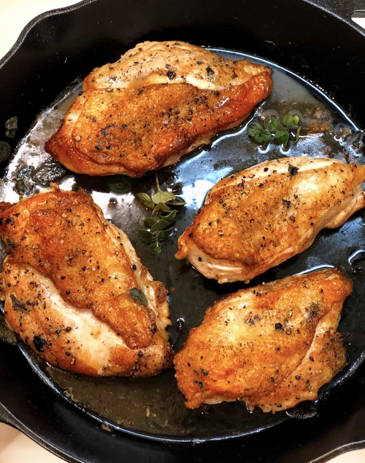 crisped up chicken breast in cast iron