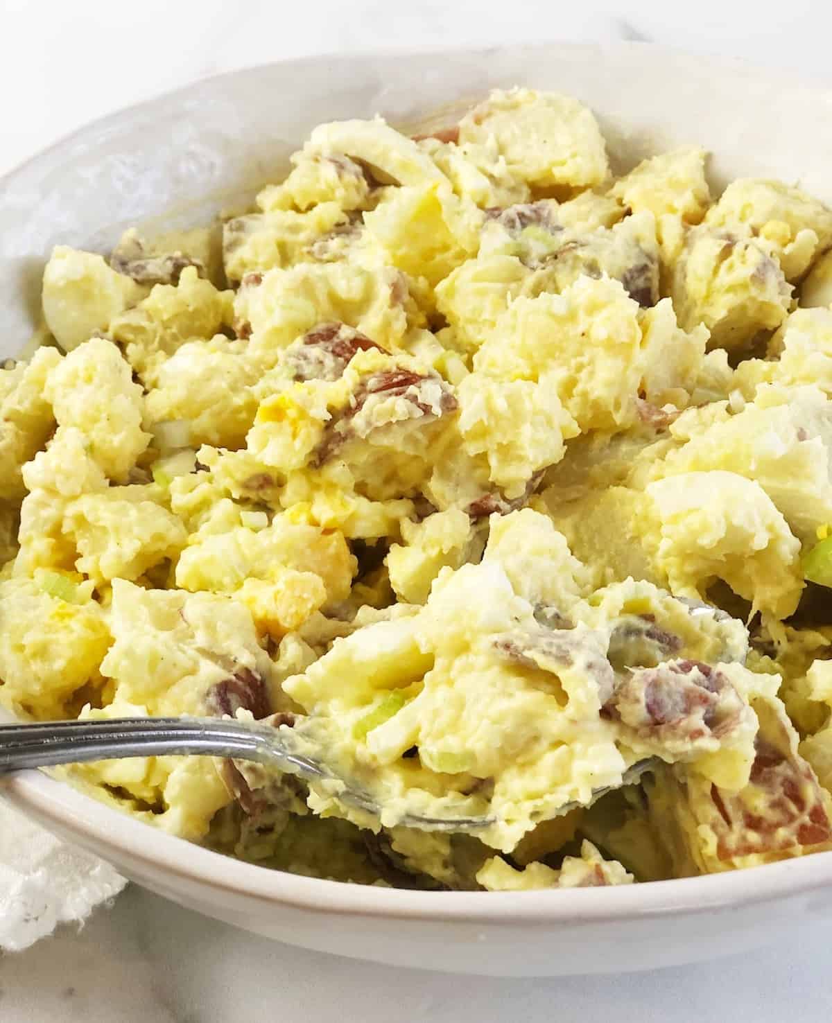 closeup of red potato salad in bowl