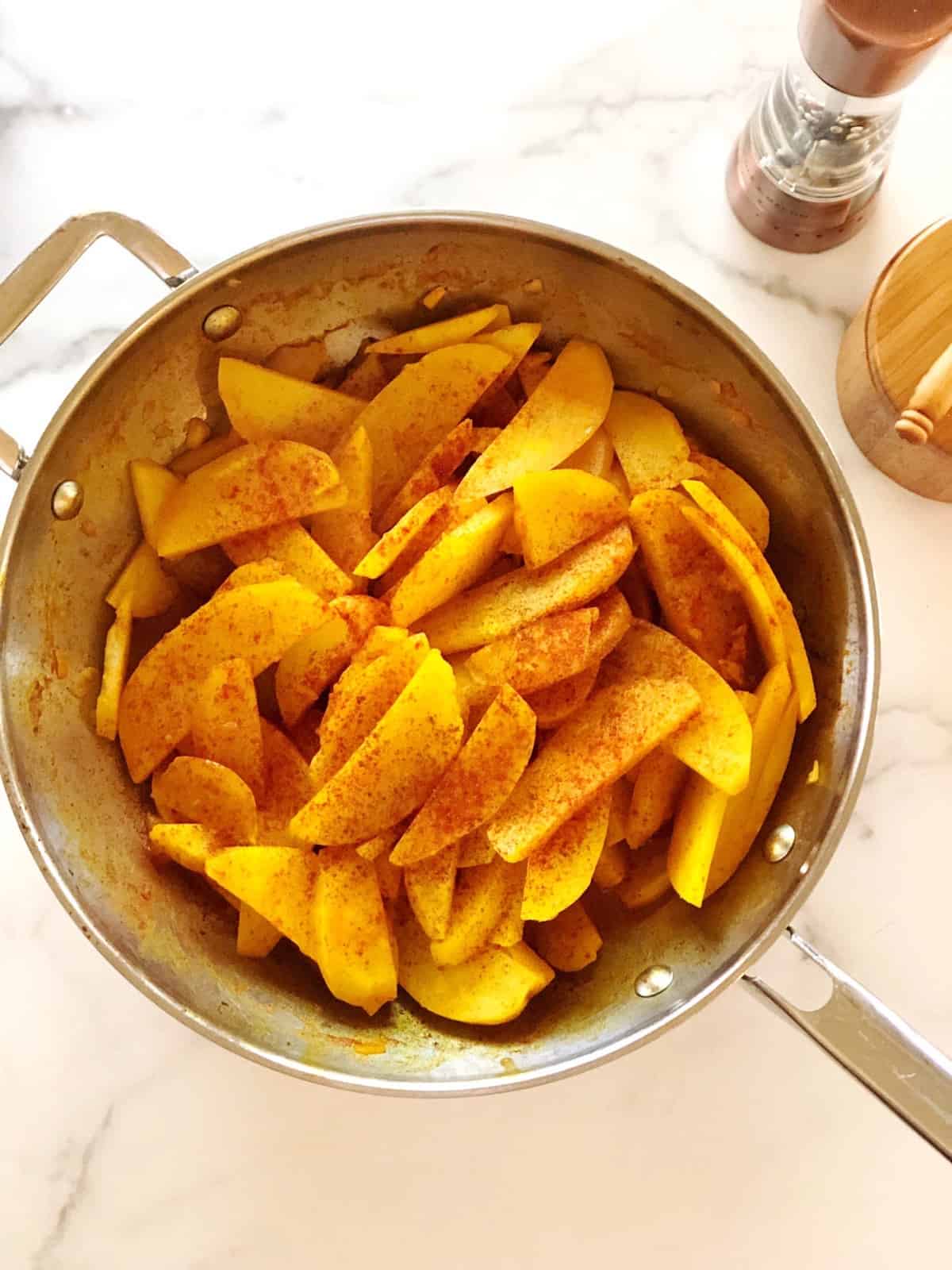 turmeric potatoes in pan
