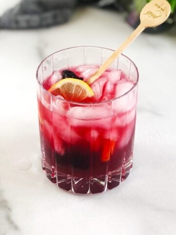 blackberry bramble in glass with stirrer