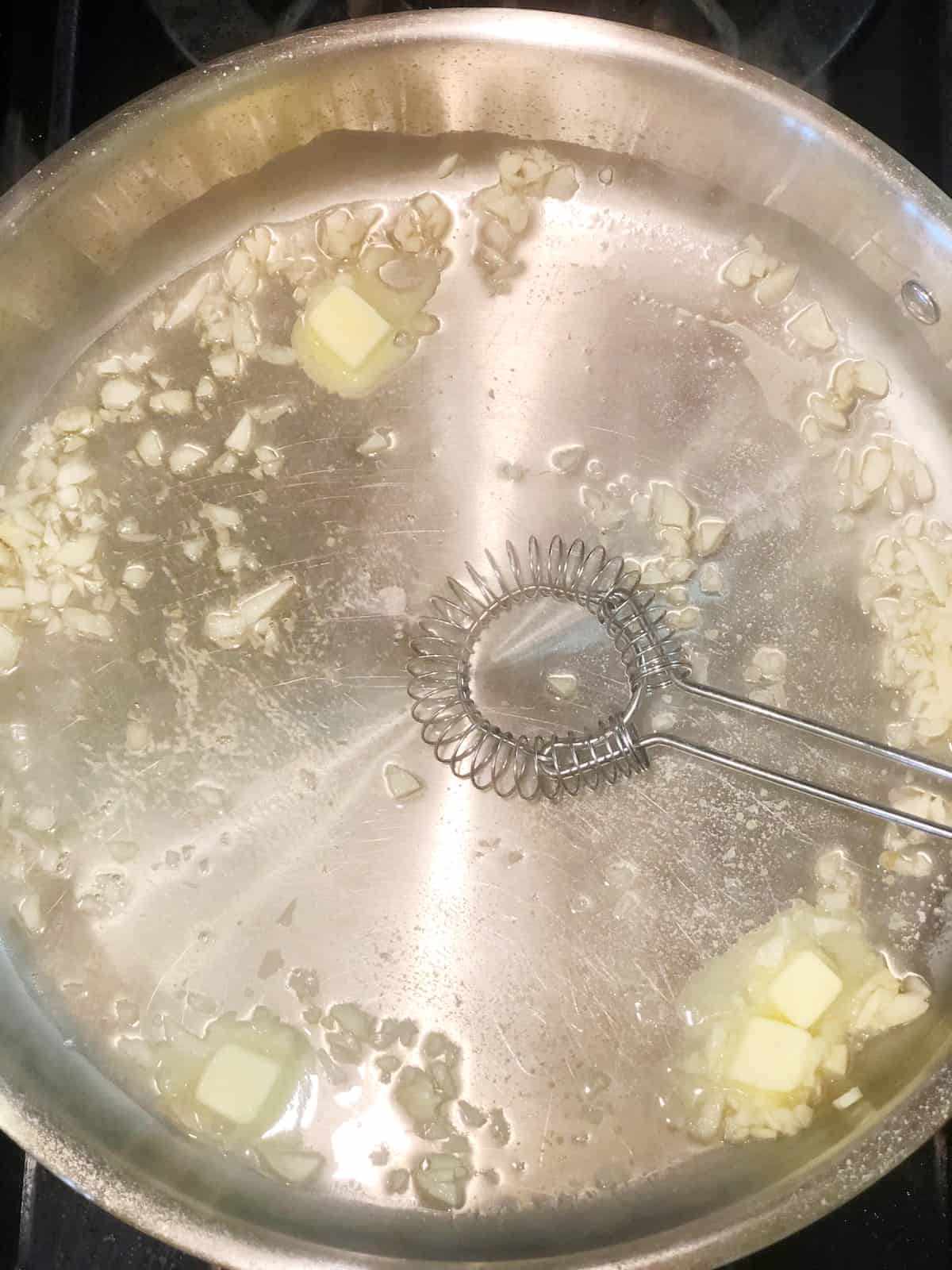 whisking butter for white wine garlic butter sauce