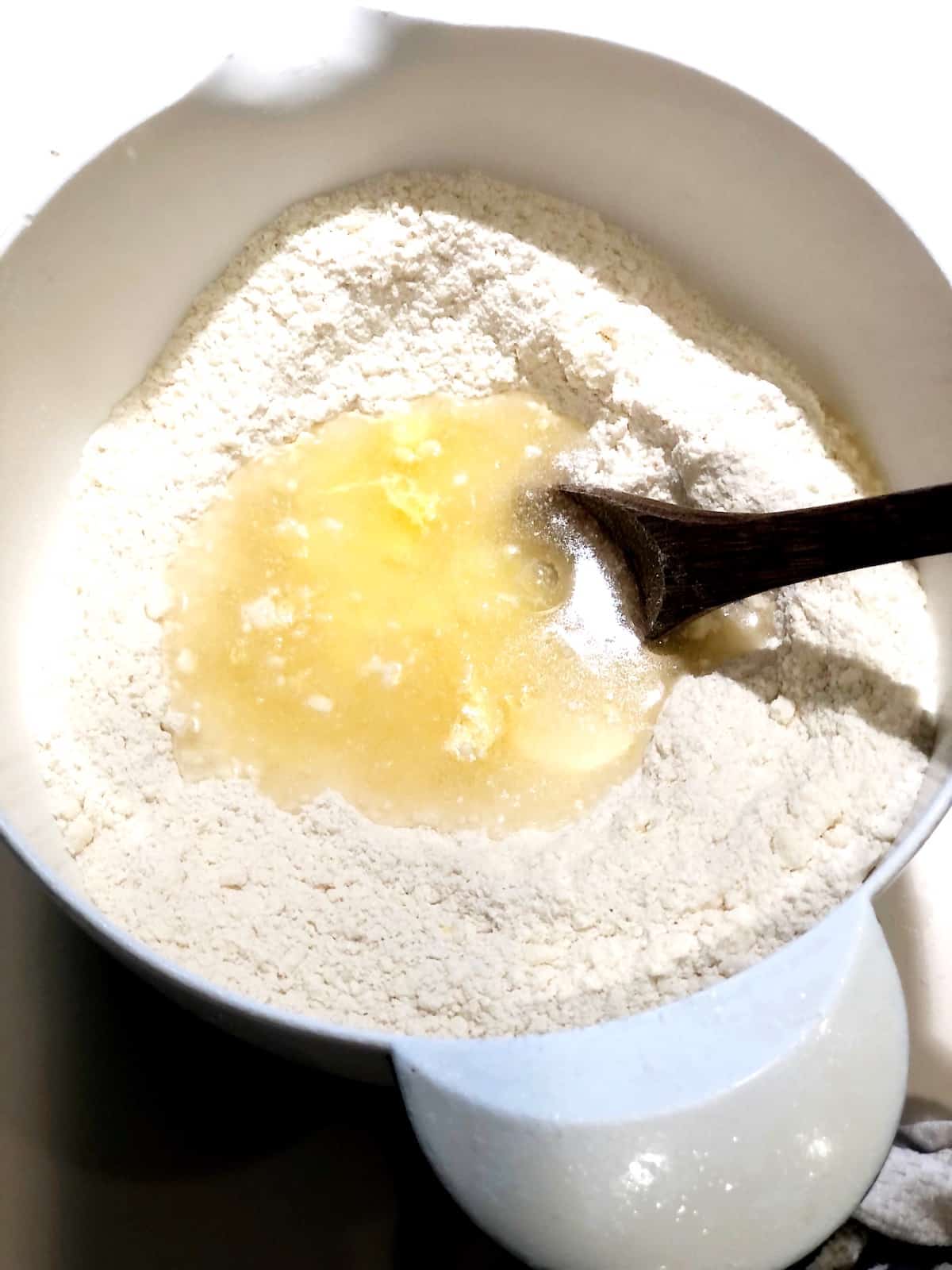 mixing wet and dry ingredients for pie crust