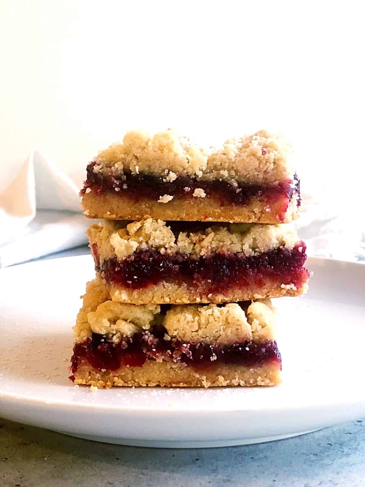 cranberry bars on plate stacked