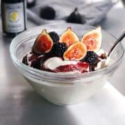 whipped cottage cheese in bowl with figs and honey topping