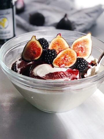whipped cottage cheese in bowl with figs and honey topping