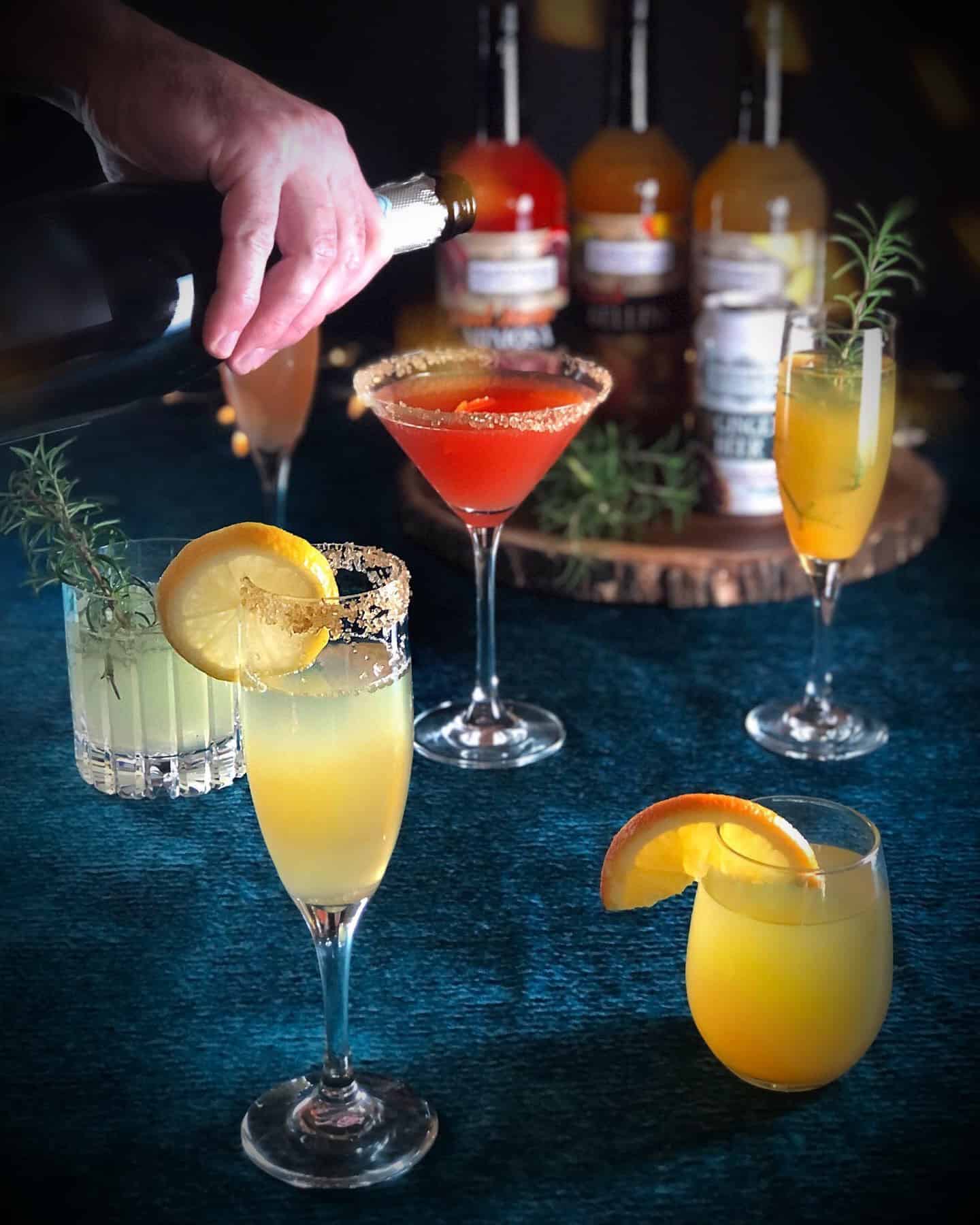 A person is pouring Aperol into a glass.