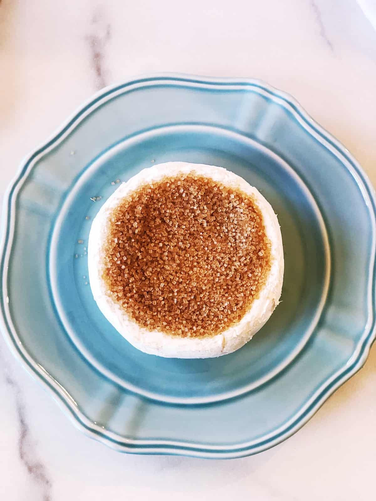 A small dessert on a blue plate.