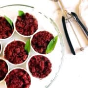 A plate of cherry granita on a white plate.
