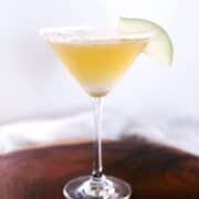pear martini in martini glass with a pear slice garnish