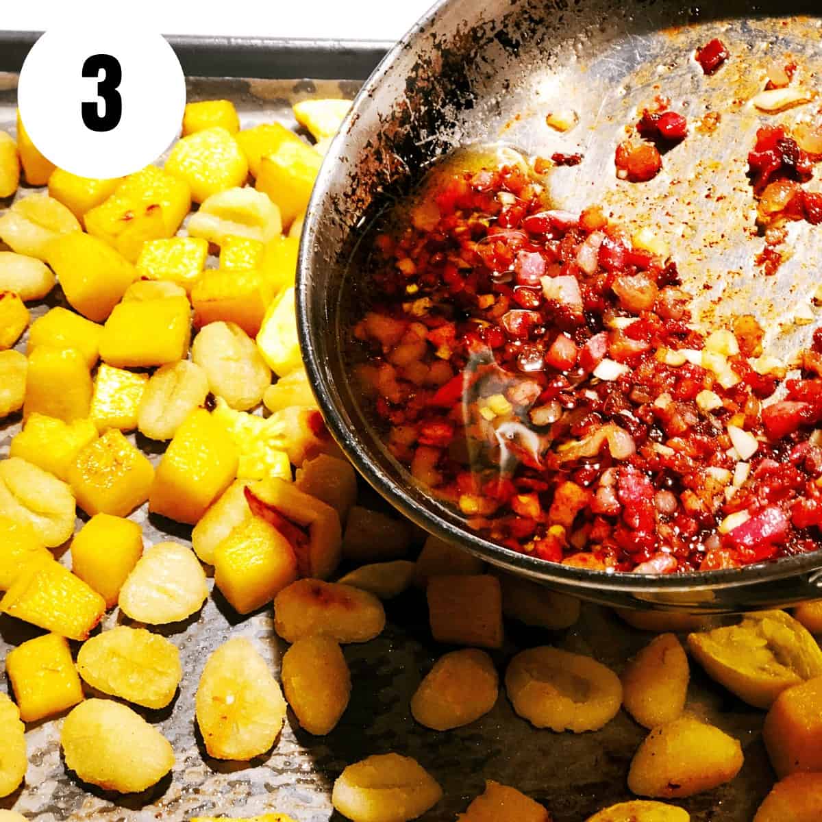Add sauce to the gnocchi and pumpkin on a pan.