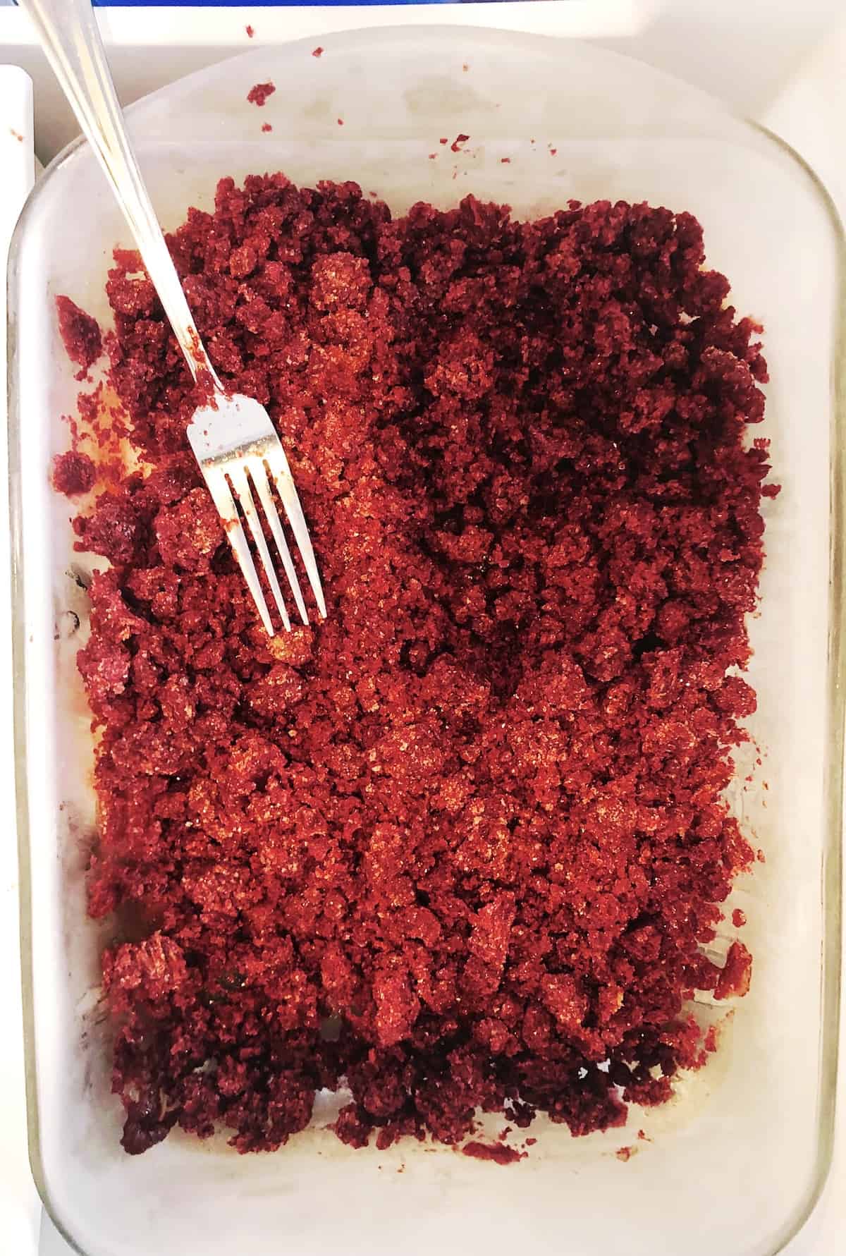 A glass dish with a fork in it.