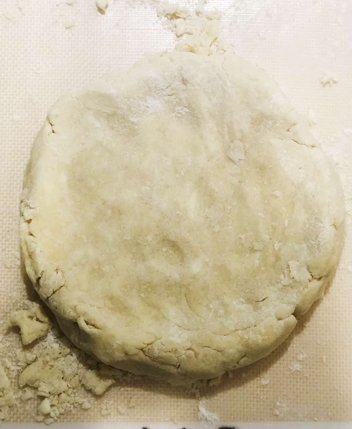 A dough is being made on a baking sheet.