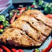 Salmon and broccoli on a baking sheet.