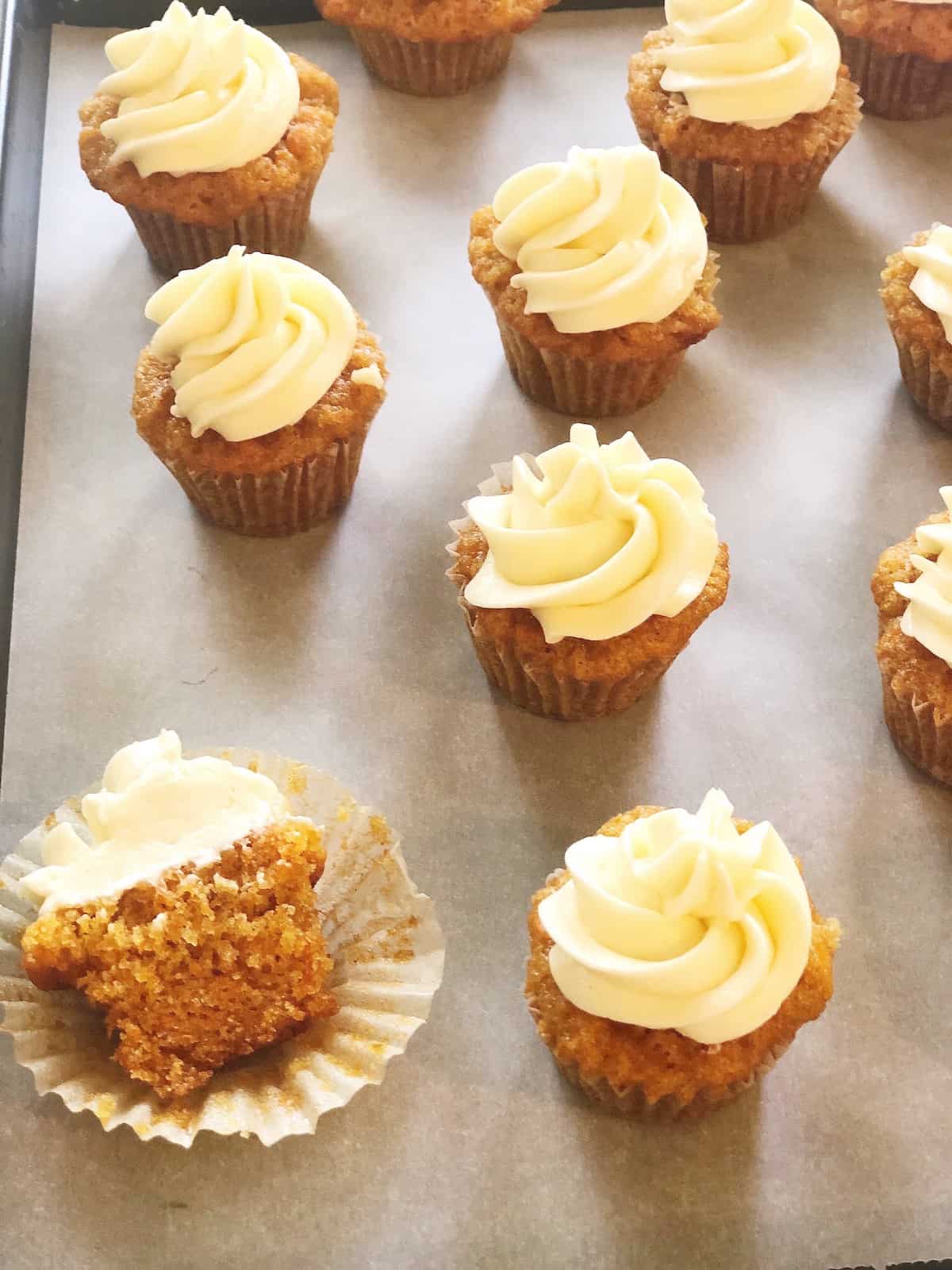 mini carrot cake cupcakes with frosting.