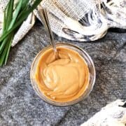 satay sauce in a bowl with a spoon.