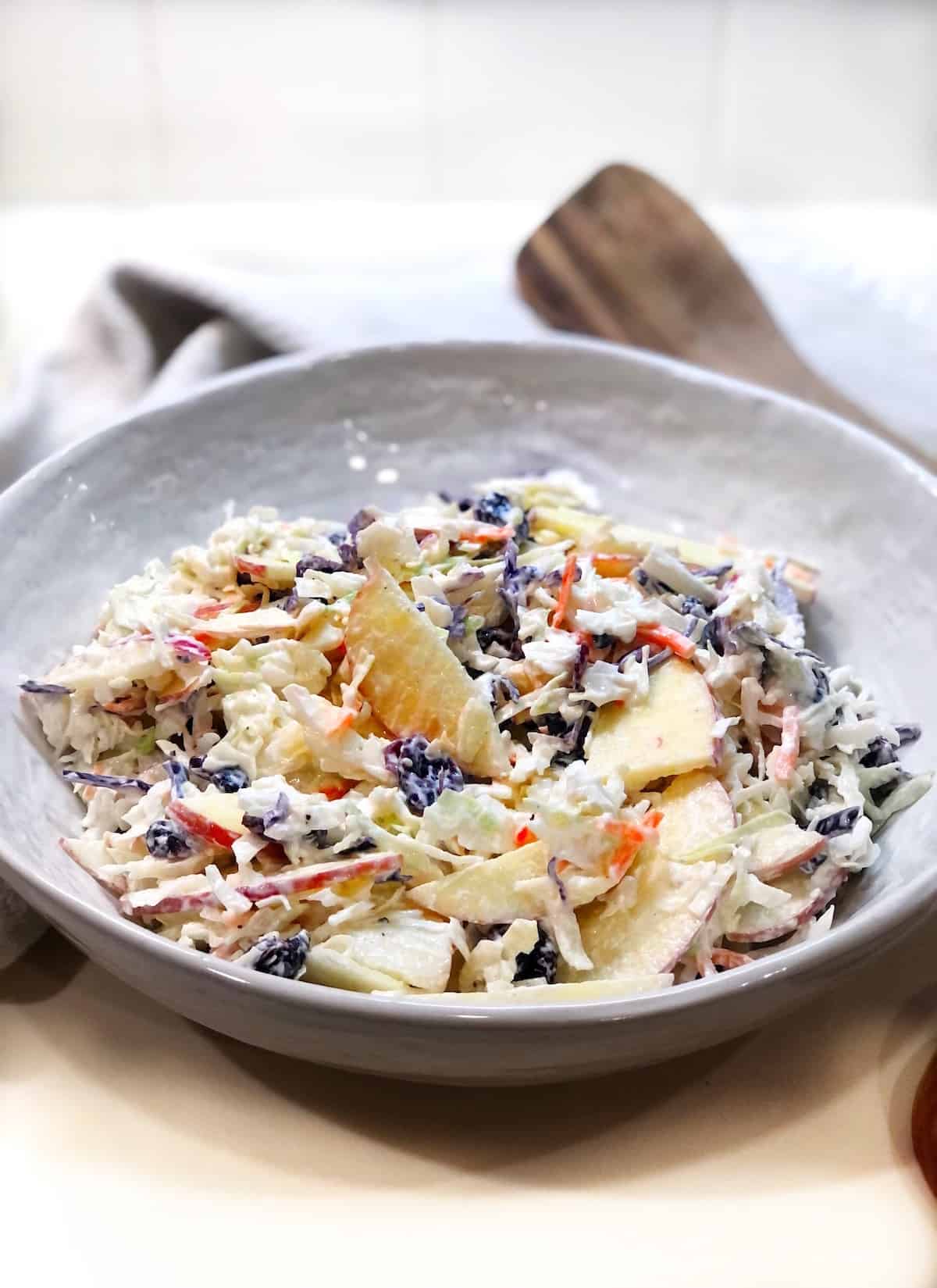 Cranberry Apple Coleslaw in a large bowl on the counter.