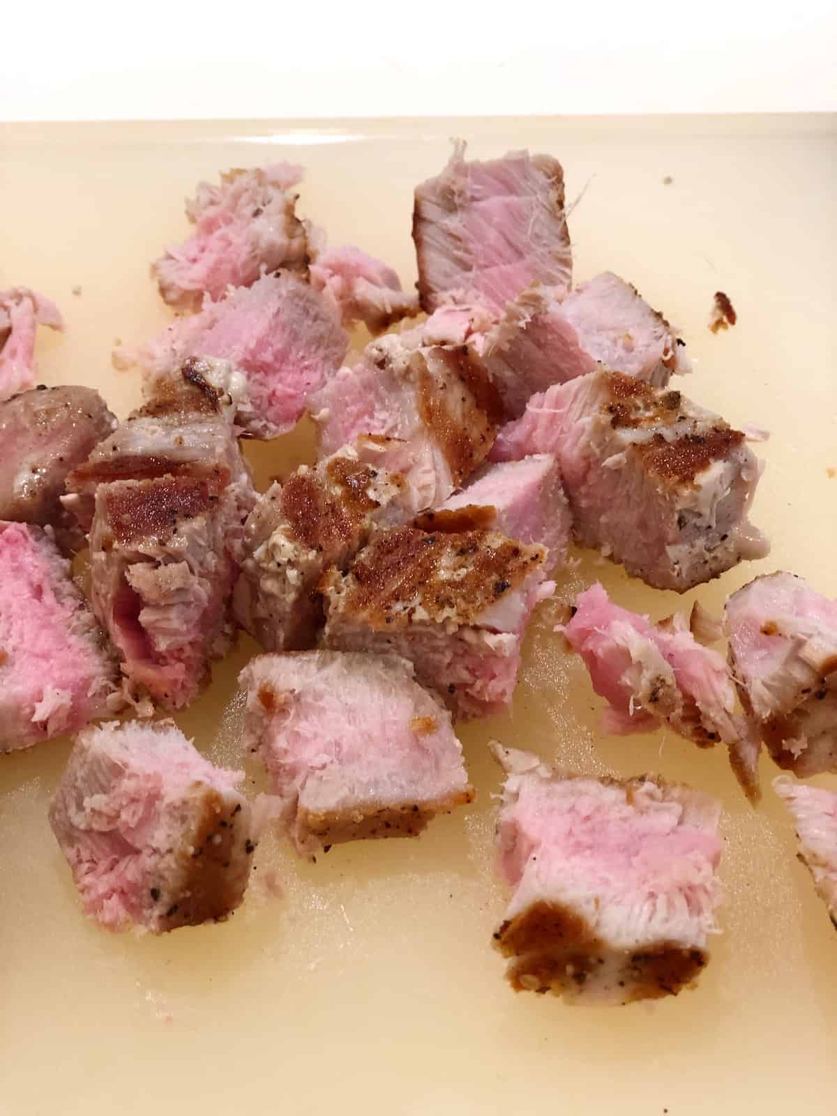 fresh tuna for pasta salad on cutting board