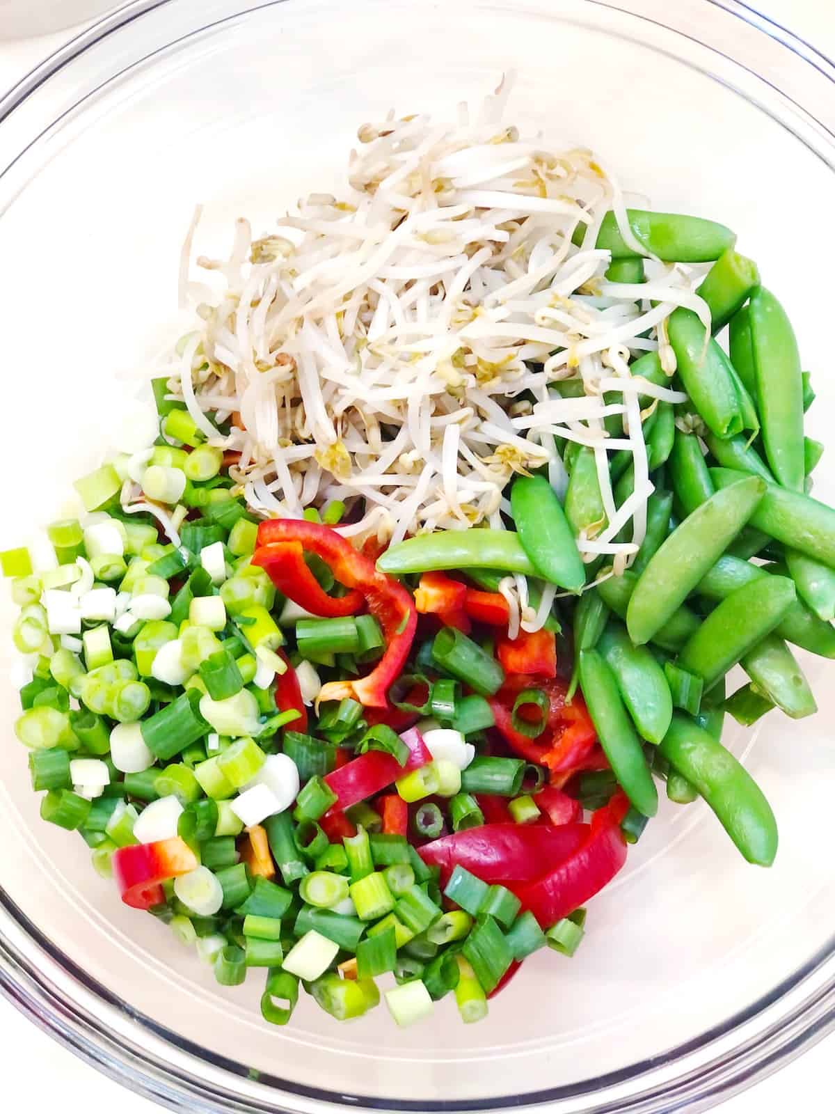 peanut pasta salad ingredients in a large bowl