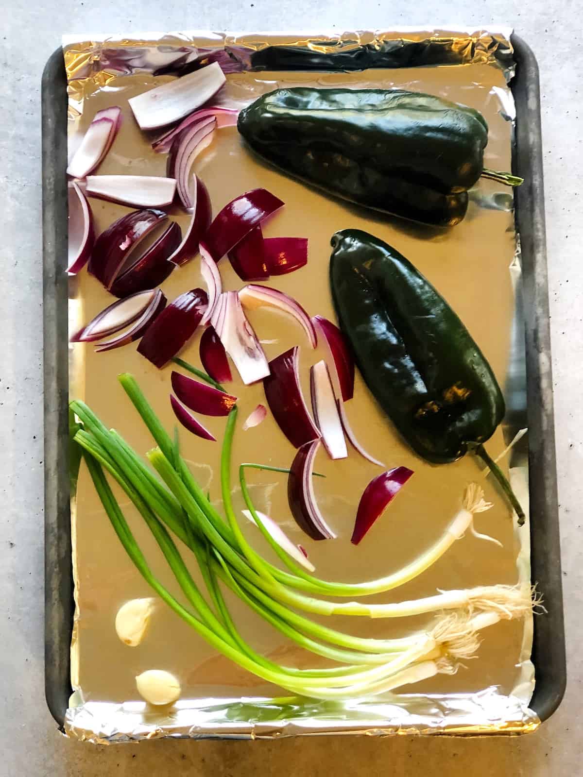 roasted poblano peppers on a sheet pan