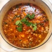 spicy sausage black bean and sweet potato soup in pot