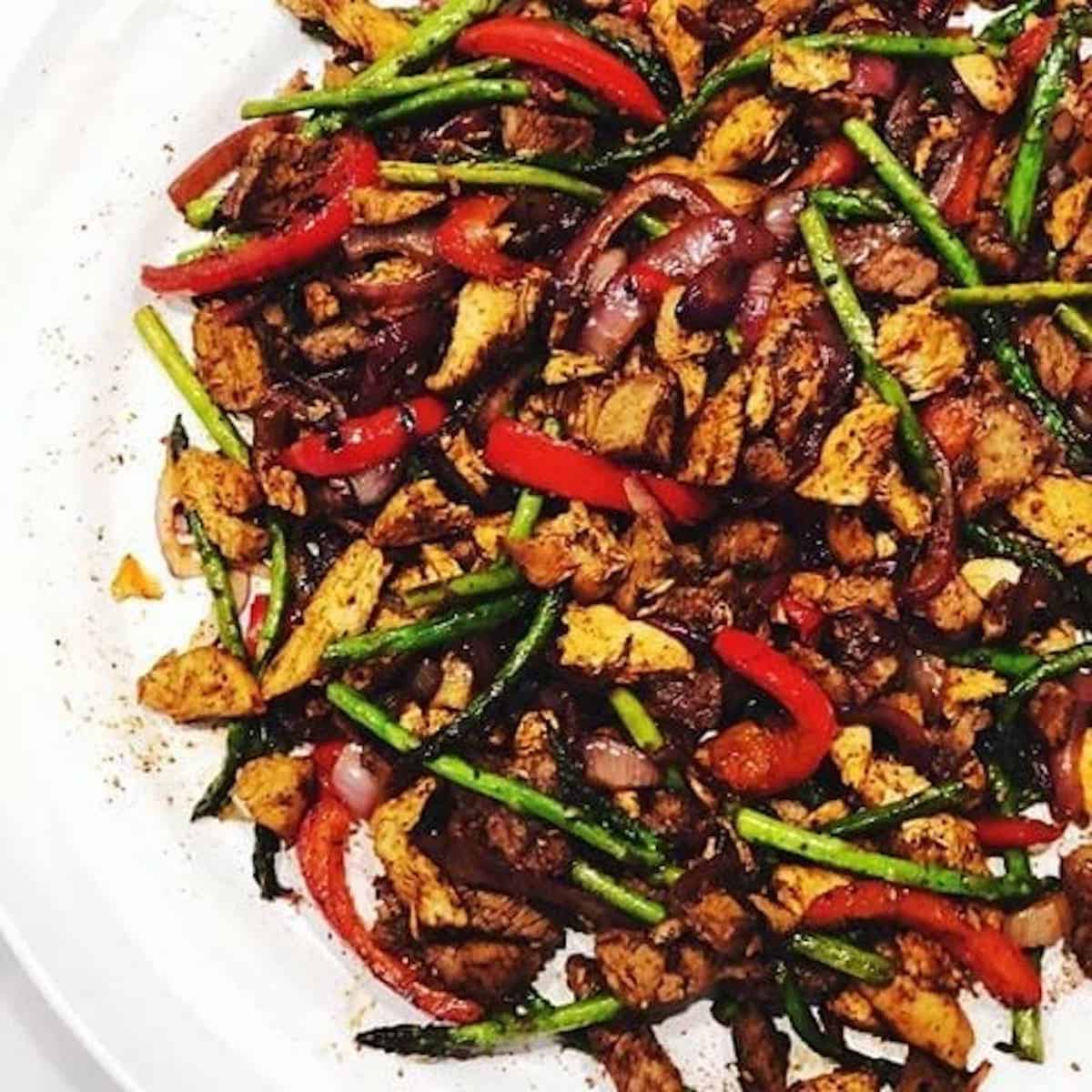 Cooked chicken fajitas on a plate.