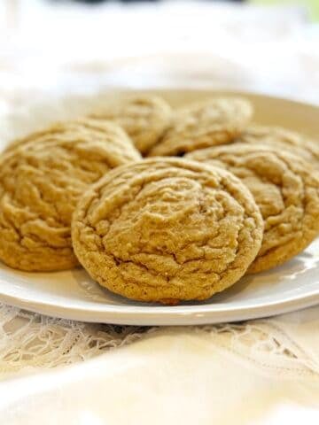 Closeup view of nutmeg sugar cookies on a plate.