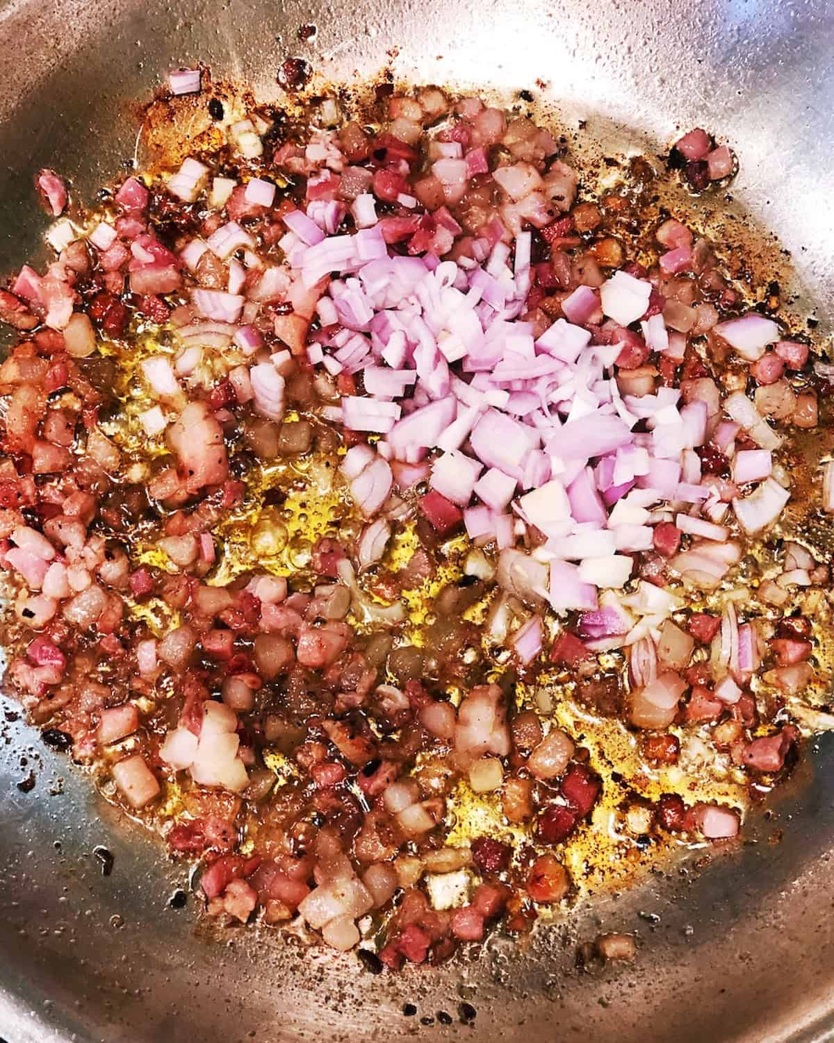 Cooking the ingredients in a large saute pan.