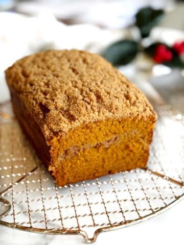 Pumpkin streusel bread on a cooling rack.