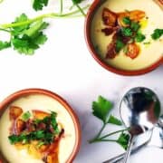 Garlic potato soup in bowls.