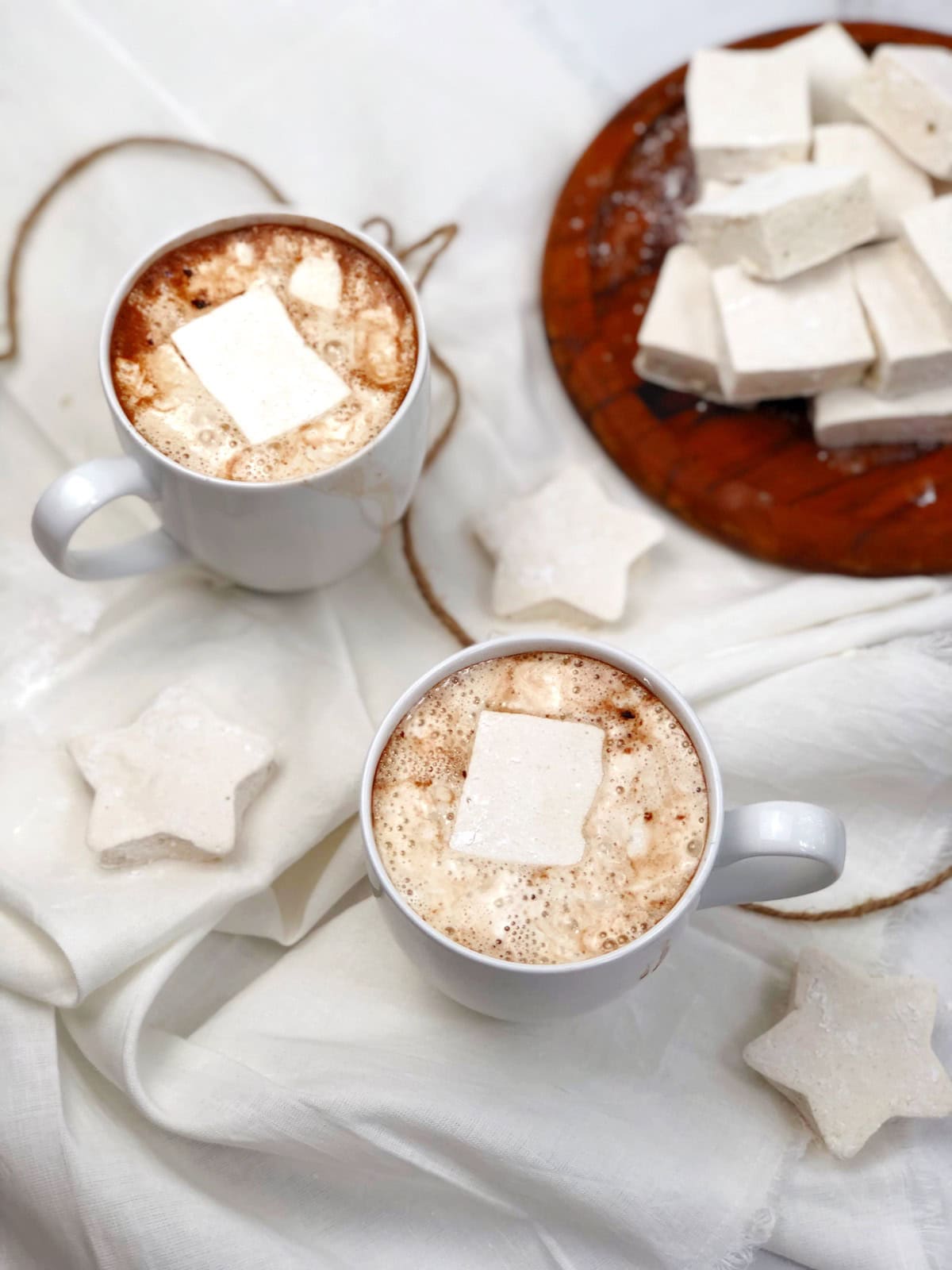 homemade marshmallows in cups of hot cocoa.