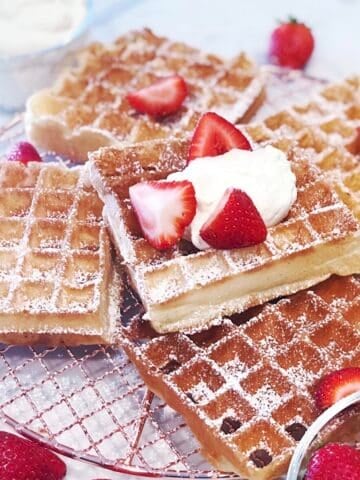 Belgian yeast waffles stacked with fresh berries.
